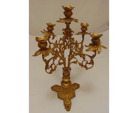 A gilded metal five light candelabrum on triform base, 48.5cm (h)