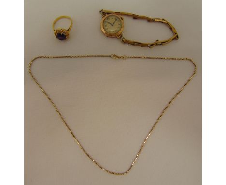 A quantity of 9ct gold jewellery to include a ring, a chain and a ladies wristwatch on a gold plated bracelet