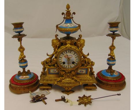 A 19th century French gilded metal and porcelain panel mantle clock, the circular dial with Roman numerals flanked by mytholo