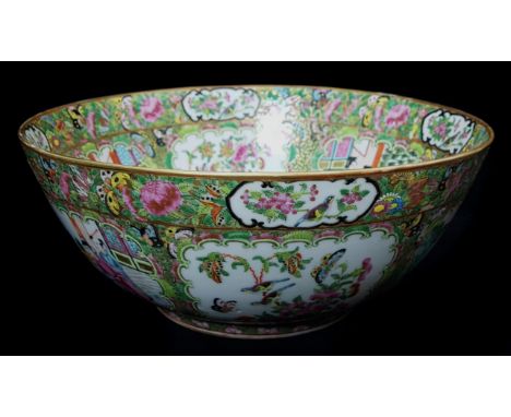 A good Chinese famille rose canton enamelled punch bowl, decorated with panels of figures and birds with insects on a peony s