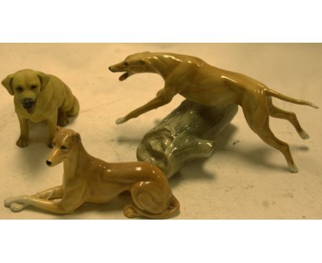 A Sylvac model of a recumbent greyhound, together with one other model of a leaping greyhound, and a seated retriever (3)