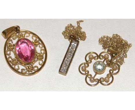 A yellow metal openwork pendant together with one other 9ct gold and a 9ct gold seed pearl set example, gross weight 8g (3)