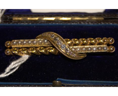 An early 20th century 15ct gold, seed pearl and diamond set bar brooch, 6.4g, 5cm, in original fitted leather case 