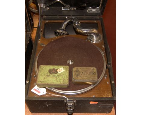 An early 20th century leather cased HMV wind-up portable gramophone