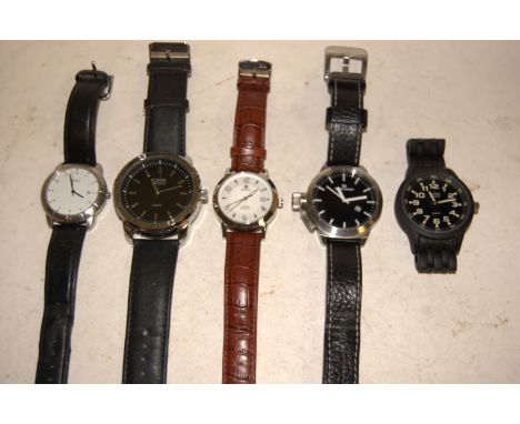 A gents Danish Design steel cased wristwatch, having black dial with white baton markers and date aperture, numbered IQ13Q711