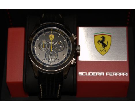 A Scuderia Ferrari stainless steel cased gents chronograph wristwatch, having black dial with baton markers, day and date ape