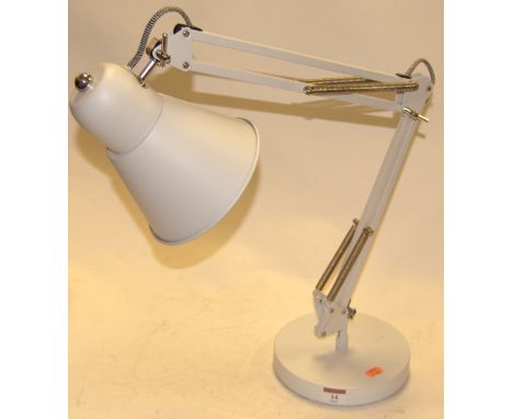 A modern white painted angle-poise desk lamp