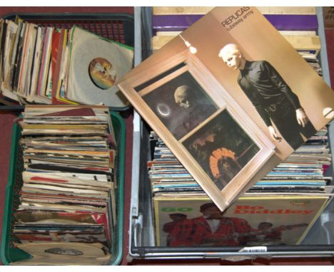 A large collection of assorted 7" and long playing records to include; The Carpenters, Pretenders, Billy Joel, Lionel Richie 