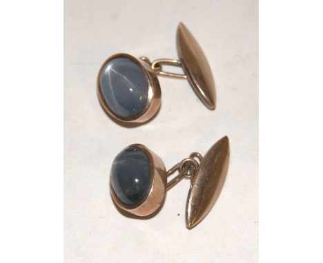 A pair of 9ct gold and cabochon 'star' sapphire set gents cufflinks, 1.2cm    Condition Report / Extra Information  One with 