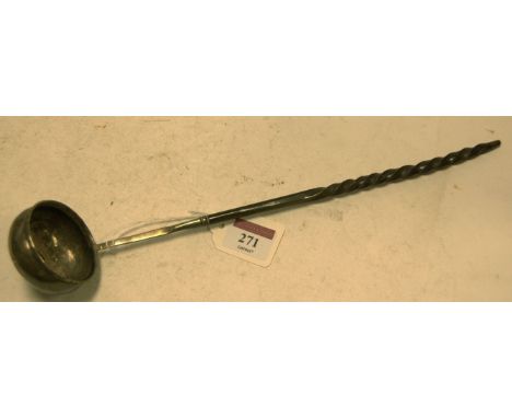 A 19th century white metal and coin inset toddy ladle on a spirally turned whalebone handle