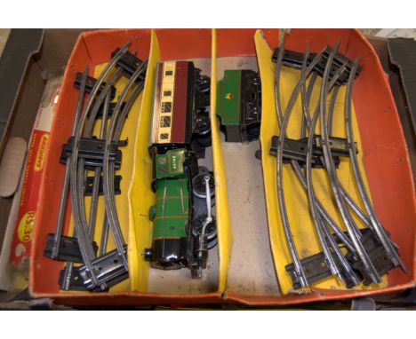 An incomplete mid 20th century Hornby 0 gauge train set together with Triang Railways RS30 Train set, and a Traing Scalextric