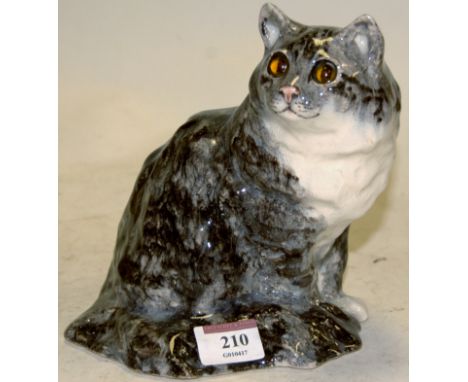 A Winstanley model of a seated cat, signed verso