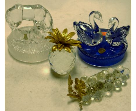 A Swarovski crystal model of a pineapple together with one other of a bunch of grapes, and two Royal Rock Crystal horse and f
