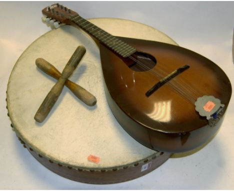 A modern Chinese violin and bow in fitted case together with an Italian lute and a hide covered drum (3)