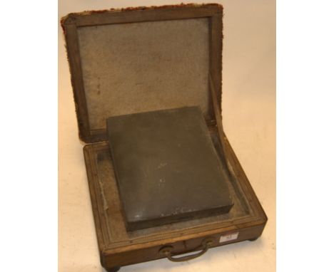 An early 20th century walnut ladies foot warmer, having a tapestry covered hinged top and zinc canister to the interior 