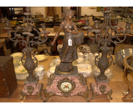 A late 19th century French spelter and gilt metal mounted marble cased mantel clock, the central clock having an enamelled di