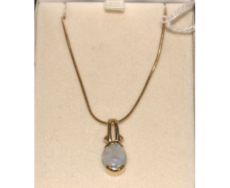 A modern 18ct gold and cabochon opal set pendant 2.2cm, on finelink neck chain