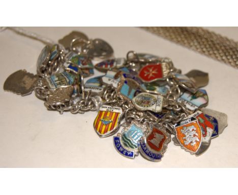 A modern silver meshlink necklace, and a silver curblink bracelet, with enamel set metal charms (2) 