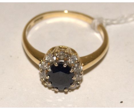 A ladies 18ct gold, sapphire and diamond cluster ring, size R   Condition Report / Extra Information  Weight 3.9g.