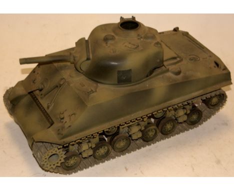 A Tamiya plastic kit built radio controlled model of a tank   Condition Report / Extra Information  Incomplete.