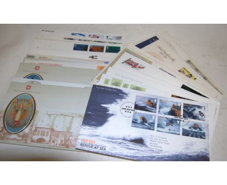 A box of assorted first day covers dating the 1980s onwards