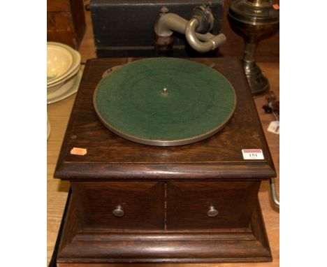 An early 20th century oak cased HMV wind-up table top gramophone together with various gramophone records