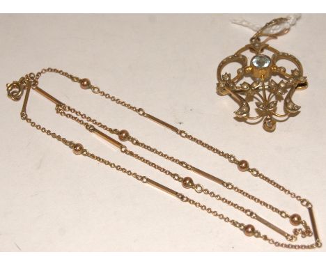 An Edwardian 9ct gold blue topaz and seed pearl set open work pendant together with a 9ct gold finelink necklace (2)   Condit