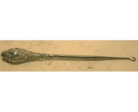 A large Edwardian silver handled button hook