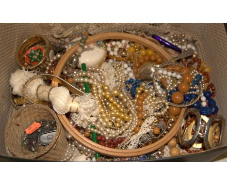 A large collection of assorted costume jewellery to include; faux pearl necklaces, gold plated bangle etc 