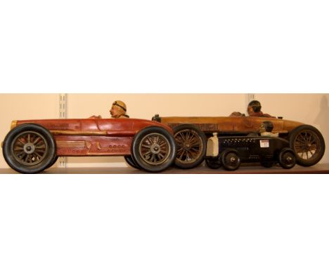 A large reproduction resin model of a racing car; together with two smaller examples (3)