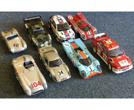 Nine various 1:18 scale unboxed model racing cars. Est. £20 - £30.