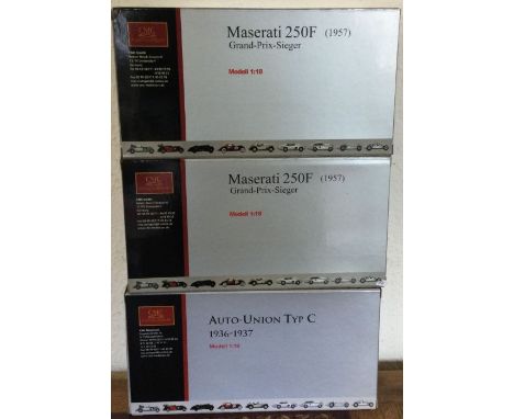 CMC: Three various boxed 1:18 scale Maserati model racing cars. Est. £100 - £200.