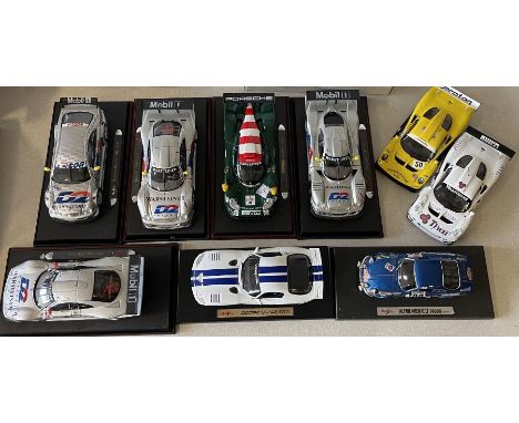 Nine various unboxed 1:18 scale model racing cars. Est. £30 - £40.