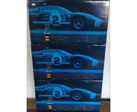 EXOTO: Three various 1:18 scale Ford GT40 boxed model racing cars. Est. £40 - £60.