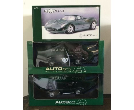 AUTOart Racing Division: Three various boxed model racing cars, scale 1:18. Est. £20 - £30.