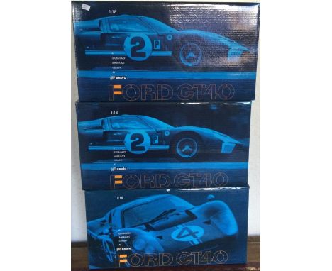 EXOTO: Three various 1:18 scale Ford GT40 boxed model racing cars. Est. £40 - £60.