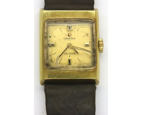 Omega; ladies Deville wristwatch on black leather strap, not working at lotting. Requires attention, glass damaged. P&amp;P G