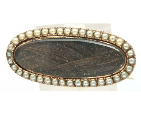 Yellow metal Georgian/Victorian mourning brooch set with seed pearls, L: 29 mm, 3.6g. P&amp;P Group 1 (£14+VAT for the first 