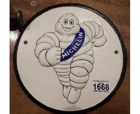Cast iron Michelin Man running sign, D: 25 cm. P&amp;P Group 2 (£18+VAT for the first lot and £3+VAT for subsequent lots) 