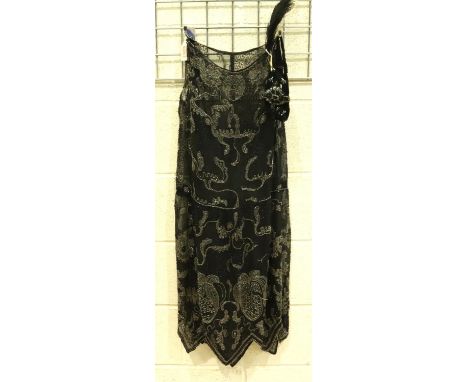 Black 1920s flapper dress and head dress, heavily beaded, some losses to beading. P&amp;P Group 2 (£18+VAT for the first lot 