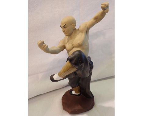 Ceramic figurine of a Sholan monk performing martial arts, H: 25 cm. Not available for in-house P&amp;P, contact Paul O'Hea a