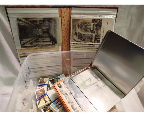 Collection of vintage postcards in album and a quantity of tea cards. P&amp;P Group 2 (£18+VAT for the first lot and £3+VAT f