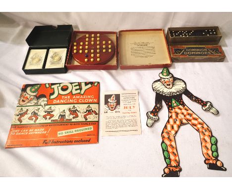 Three vintage games including Dominoes and Joey dancing clown. P&amp;P Group 1 (£14+VAT for the first lot and £1+VAT for subs