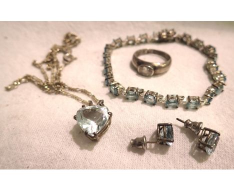 White metal and lilac stone jewellery set including ring, earrings, necklace and bracelet. P&amp;P Group 1 (£14+VAT for the f