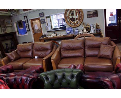 Pair Ercol Ravenna two seater settees in tan leather