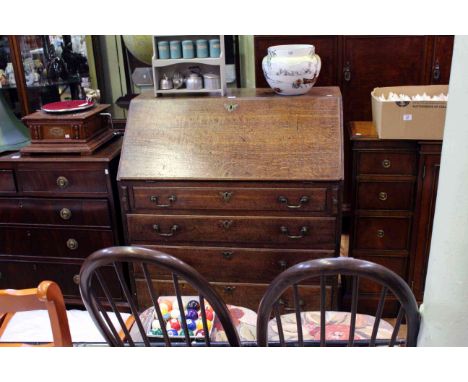 Georgian oak four drawer bureau on ogee bracket feet, 107cm by 93cm