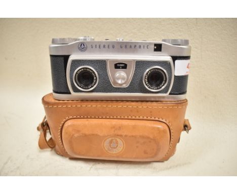 A Graflex Stereo Graphic camera No1008095 with Graflex 35mm f4 lens in original leather cover