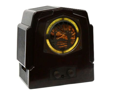 An Art Deco Bakelite 'Willow Trees' Radio by Ecko, type R.S. 3, in a shaped stepped rectangular case, the front with cream st