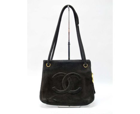 Chanel; A Vintage Black Leather Tote Bag, with stitched logo to front, 'CC' medallion and hardware, rolled leather handles, m