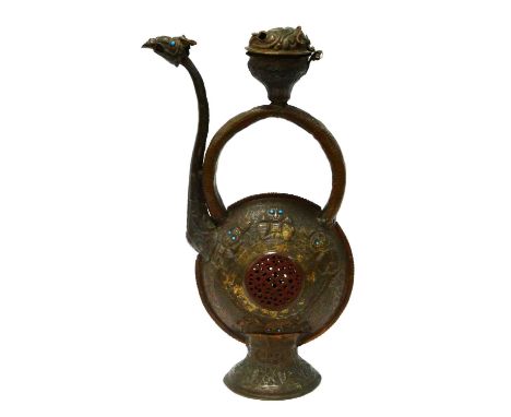 An Early Islamic Metal Ewer, with embossed decoration, the circular body inset with turquoise coloured beads, bird spout, 48c